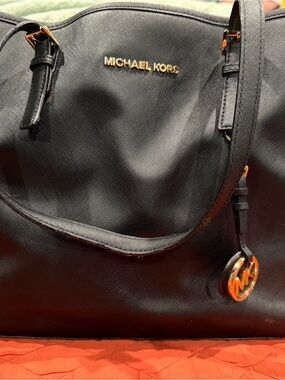 Michael Kors Black Leather Duffel Bag with Gold Hardware